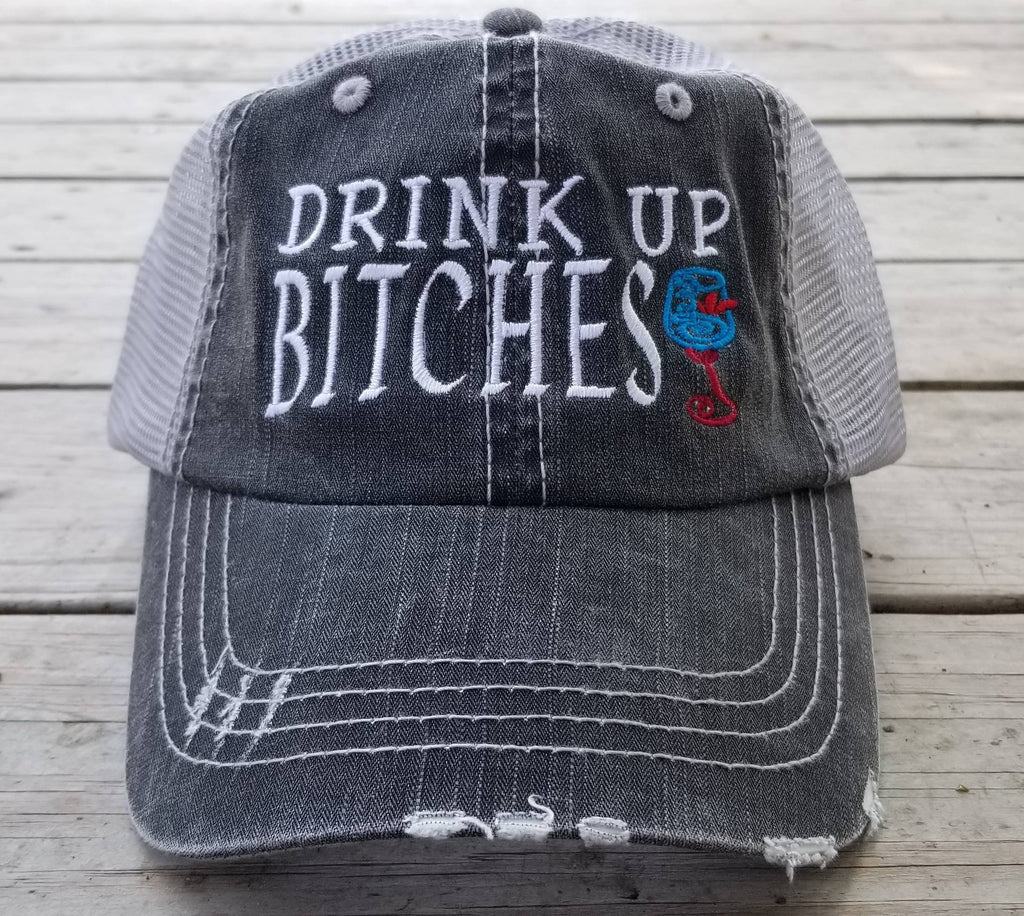 Drink up Bitches with wine glass, distressed black cap with silver gray mesh