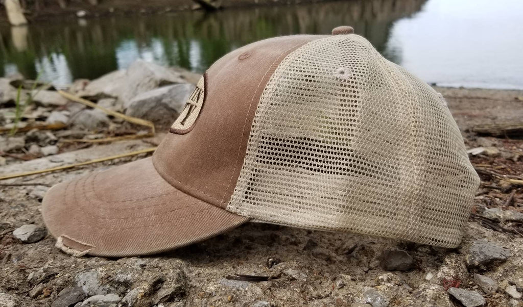Gettin Dirty oval, distressed trucker cap